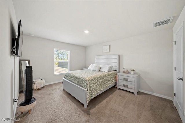 bedroom featuring light carpet, baseboards, and visible vents