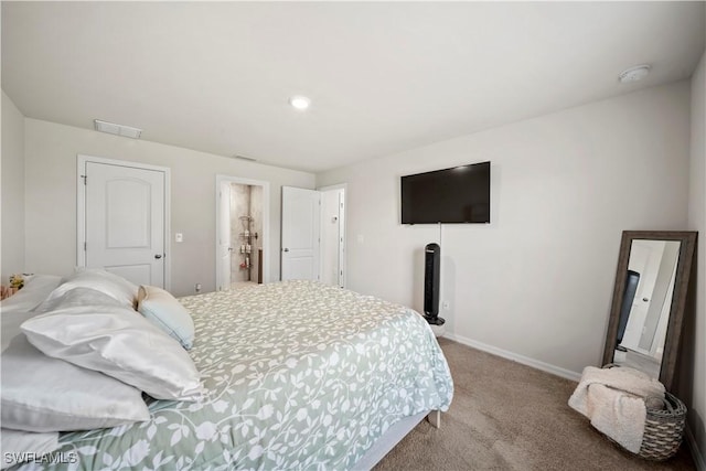 carpeted bedroom with baseboards and visible vents