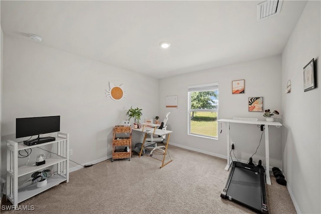 office area featuring baseboards, visible vents, and carpet