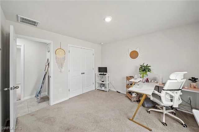 office space featuring baseboards, visible vents, and carpet flooring