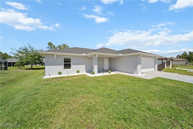 view of front of house with stucco siding, driveway, a garage, and a front lawn