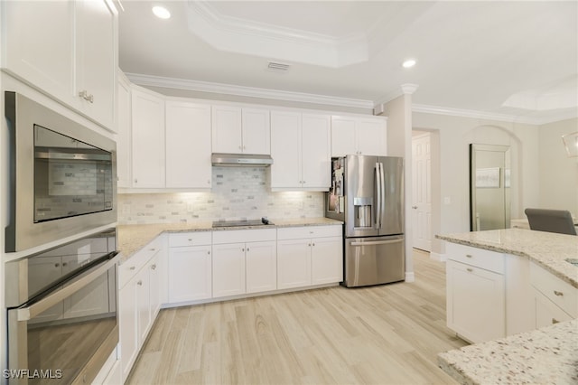 28091 Foxrock Ct, Bonita Springs, FL 34135 - kitchen with white cabinets, visible vents, under cabinet range hood, stainless steel appliances, and a raised ceiling