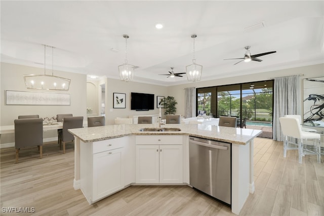 28091 Foxrock Ct, Bonita Springs, FL 34135 - kitchen with dishwasher, open floor plan, light wood-style floors, ceiling fan with notable chandelier, and pendant lighting