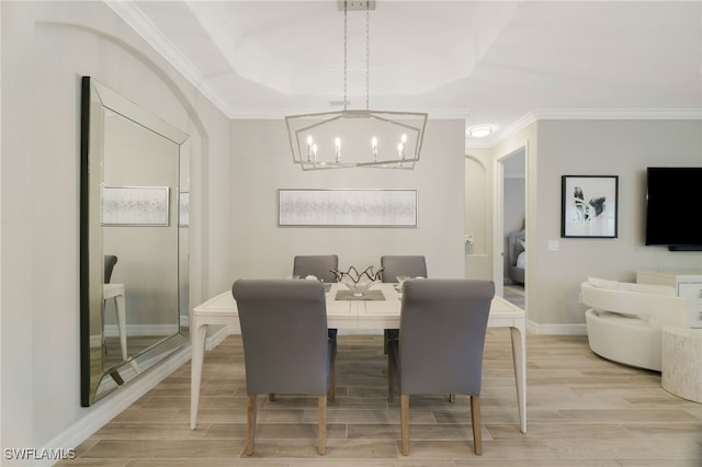 28091 Foxrock Ct, Bonita Springs, FL 34135 - dining room with baseboards, ornamental molding, light wood-type flooring, a chandelier, and a tray ceiling