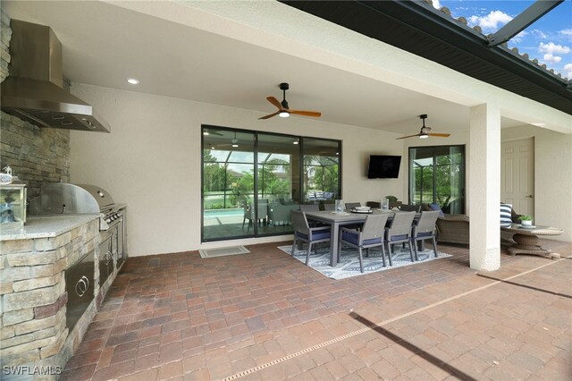 28091 Foxrock Ct, Bonita Springs, FL 34135 - view of patio / terrace featuring area for grilling, ceiling fan, exterior kitchen, a lanai, and outdoor dining space