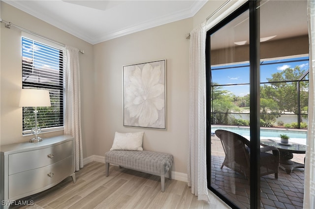 28091 Foxrock Ct, Bonita Springs, FL 34135 - living area with baseboards, light wood-type flooring, and crown molding