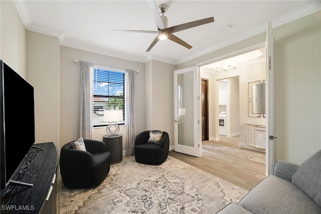 28091 Foxrock Ct, Bonita Springs, FL 34135 - sitting room featuring baseboards, ornamental molding, french doors, ceiling fan with notable chandelier, and wood finished floors