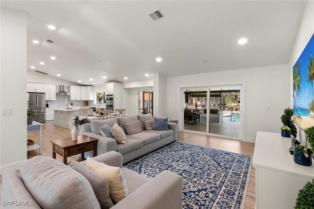 1020 19th St SW, Naples, FL 34117 - living area with light wood-style flooring, recessed lighting, and vaulted ceiling