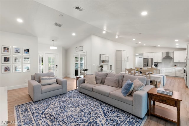 1020 19th St SW, Naples, FL 34117 - living room featuring vaulted ceiling, light wood finished floors, and recessed lighting