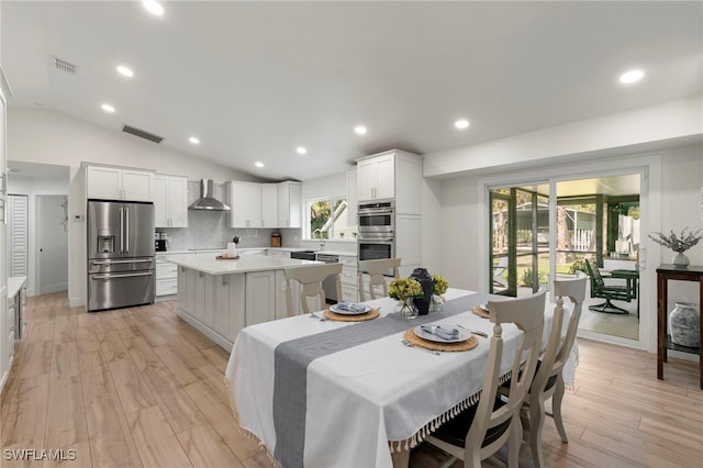 1020 19th St SW, Naples, FL 34117 - dining room featuring light wood-style floors, recessed lighting, and vaulted ceiling