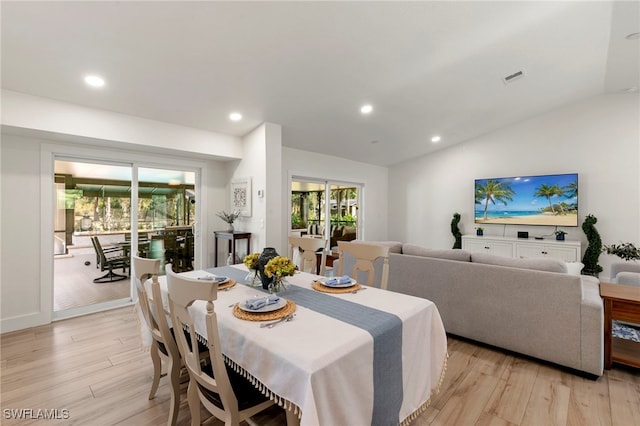 1020 19th St SW, Naples, FL 34117 - dining area with light wood-style floors, vaulted ceiling, and recessed lighting