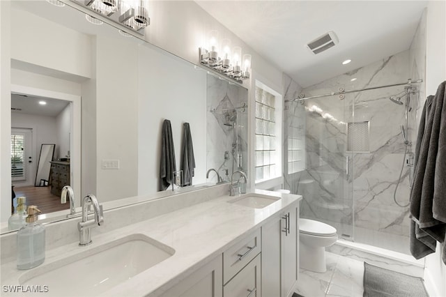 1020 19th St SW, Naples, FL 34117 - full bath featuring a marble finish shower, double vanity, marble look tiles, and recessed lighting