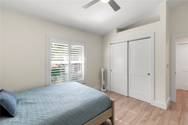 1020 19th St SW, Naples, FL 34117 - bedroom with lofted ceiling, light wood-style floors, baseboards, a closet, and a ceiling fan