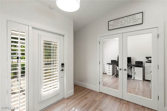 1020 19th St SW, Naples, FL 34117 - doorway to outside featuring french doors, wood finished floors, baseboards, and a desk