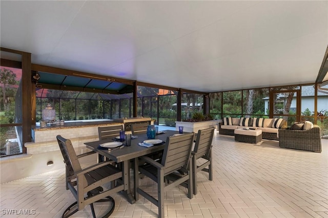 1020 19th St SW, Naples, FL 34117 - sunroom / solarium with outdoor lounge area, healthy amount of natural light, and outdoor dining area