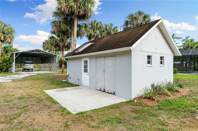 1020 19th St SW, Naples, FL 34117 - view of outbuilding with a detached carport and driveway