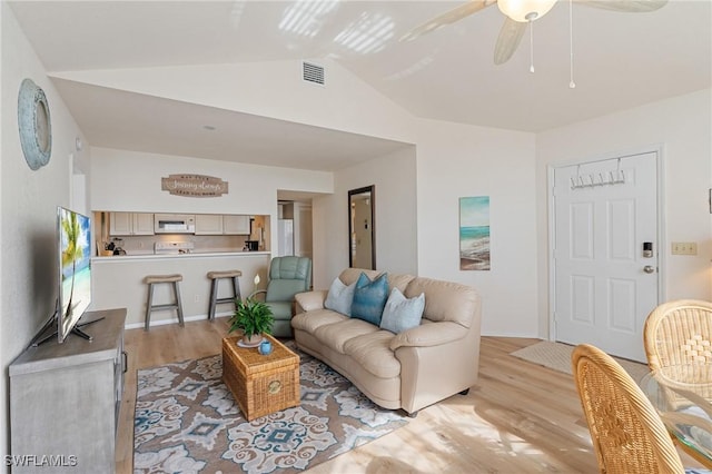 4160 Gunnison Ct Unit 821, Estero, FL 33928 - living room with visible vents, light wood-type flooring, vaulted ceiling, and a ceiling fan