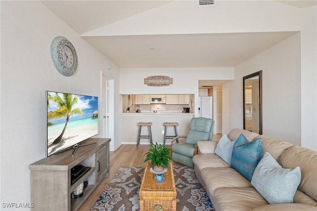 4160 Gunnison Ct Unit 821, Estero, FL 33928 - living area featuring visible vents, light wood-style floors, and lofted ceiling