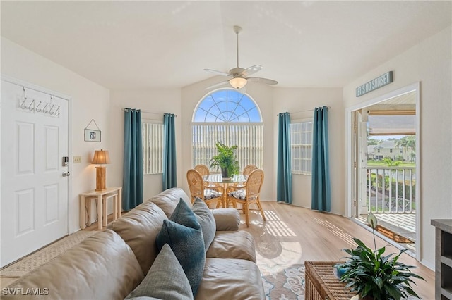 4160 Gunnison Ct Unit 821, Estero, FL 33928 - living room featuring ceiling fan, lofted ceiling, wood finished floors, and a healthy amount of sunlight