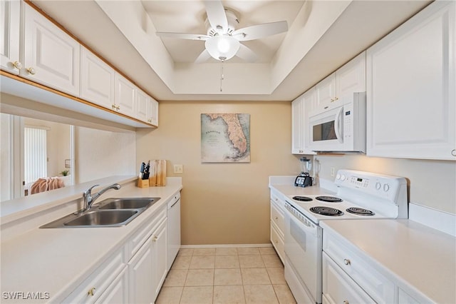 4160 Gunnison Ct Unit 821, Estero, FL 33928 - kitchen with a raised ceiling, white cabinetry, a sink, and white appliances