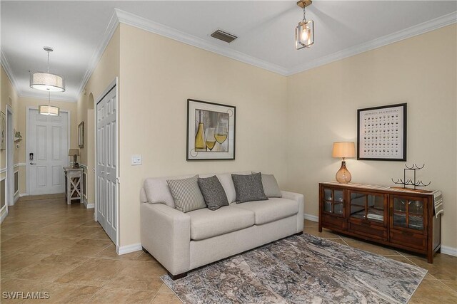 9815 Giaveno Ct Unit 1245, Naples, FL 34113 - living area featuring crown molding, baseboards, and tile patterned floors