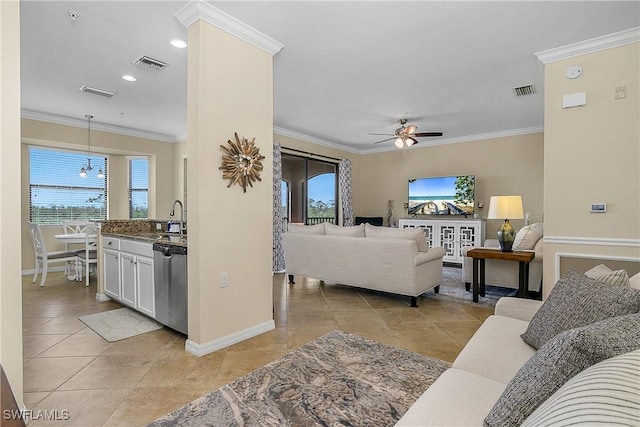 9815 Giaveno Ct Unit 1245, Naples, FL 34113 - living room featuring baseboards, a ceiling fan, ornamental molding, and light tile patterned floors