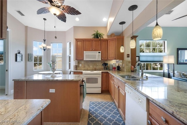 kitchen with ceiling fan, white appliances, light tile patterned flooring, a sink, and decorative backsplash