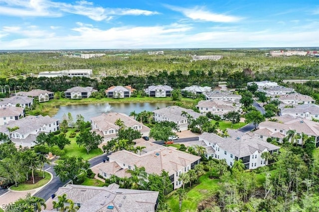 birds eye view of property featuring a water view and a residential view