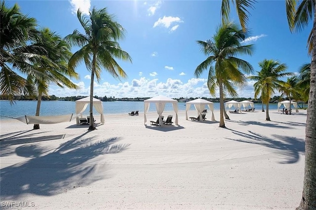 surrounding community featuring a gazebo and a water view