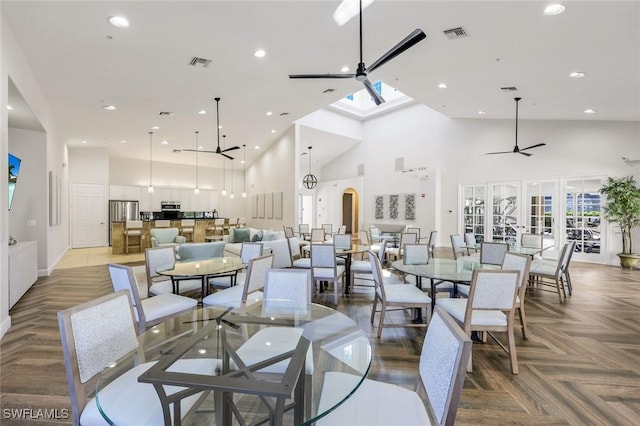 dining area with recessed lighting, visible vents, a high ceiling, and ceiling fan