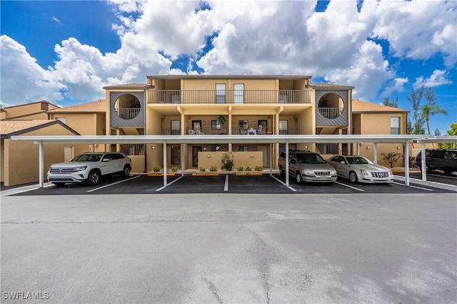 15761 Windward Way Cir Unit 3102, Fort Myers, FL 33908 - view of property featuring covered parking