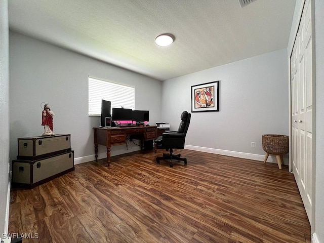 940 SE 20th Ct, Cape Coral, FL 33990 - office space with baseboards, a textured ceiling, and dark wood finished floors