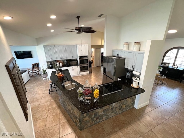 940 SE 20th Ct, Cape Coral, FL 33990 - living room with light tile patterned flooring, high vaulted ceiling, visible vents, ceiling fan, and recessed lighting