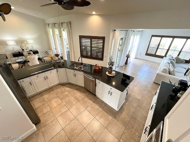 940 SE 20th Ct, Cape Coral, FL 33990 - kitchen with open floor plan, a sink, dark countertops, dishwasher, and a ceiling fan