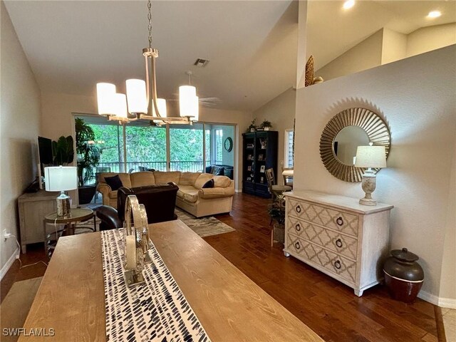 8125 Celeste Dr Unit 5213, Naples, FL 34113 - living area with baseboards, lofted ceiling, visible vents, and wood finished floors