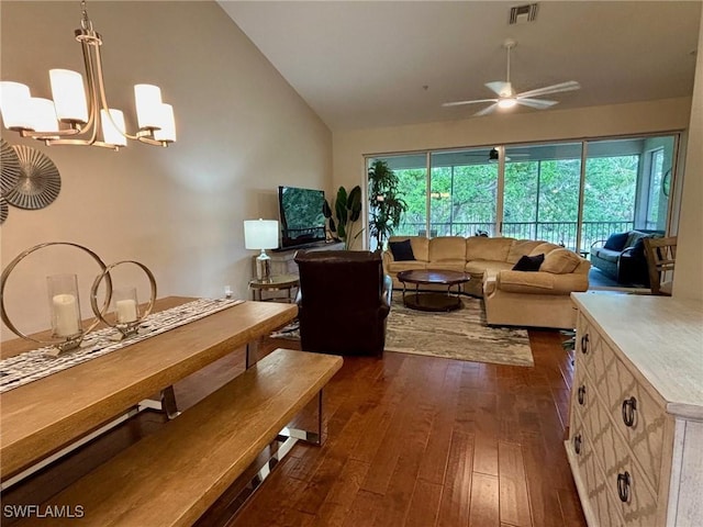 8125 Celeste Dr Unit 5213, Naples, FL 34113 - living room with dark wood-style floors, visible vents, vaulted ceiling, and ceiling fan with notable chandelier