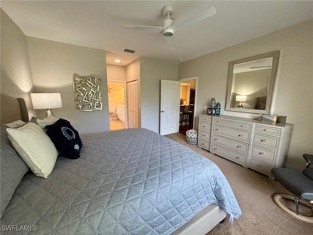8125 Celeste Dr Unit 5213, Naples, FL 34113 - carpeted bedroom featuring visible vents, a closet, ensuite bathroom, and a ceiling fan