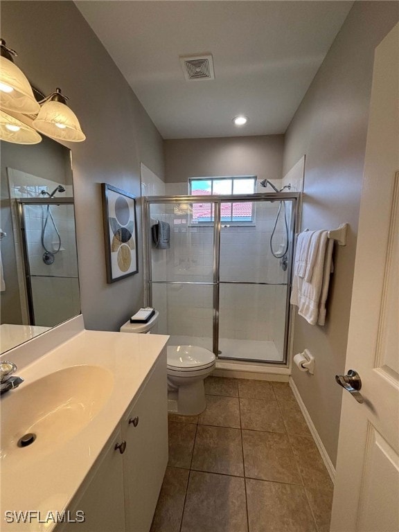 8125 Celeste Dr Unit 5213, Naples, FL 34113 - bathroom featuring visible vents, a stall shower, toilet, and vanity