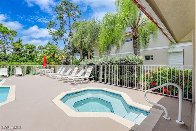 8125 Celeste Dr Unit 5213, Naples, FL 34113 - view of pool featuring a patio, fence, and a hot tub