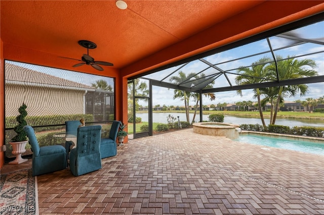11619 Giulia Dr, Fort Myers, FL 33913 - view of patio featuring a pool with connected hot tub, a water view, glass enclosure, and ceiling fan