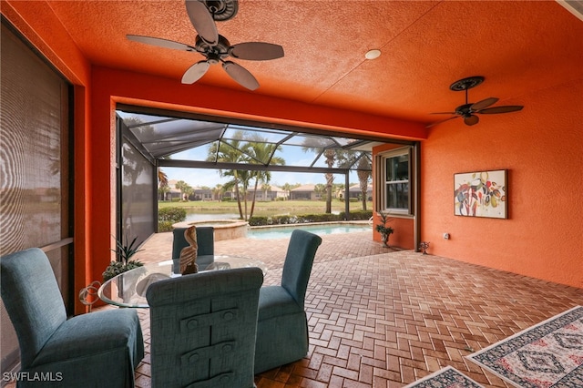 11619 Giulia Dr, Fort Myers, FL 33913 - view of patio featuring glass enclosure, a pool with connected hot tub, and ceiling fan