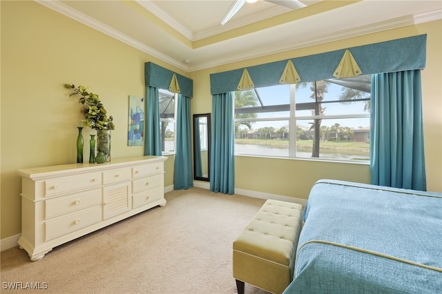 11619 Giulia Dr, Fort Myers, FL 33913 - carpeted bedroom featuring a tray ceiling, baseboards, crown molding, and a water view