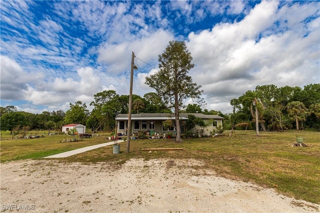 17841 Palm Creek Dr, North Fort Myers, FL 33917 - view of front of house featuring a porch and a front yard