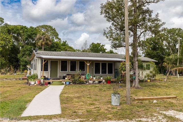17841 Palm Creek Dr, North Fort Myers, FL 33917 - view of front of house with a front lawn and a porch