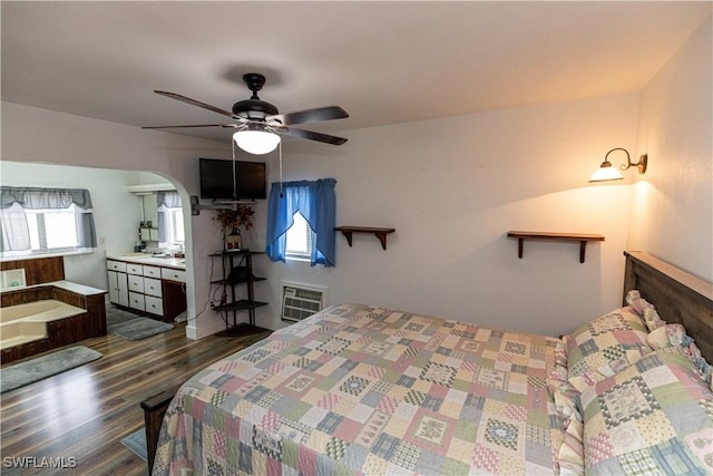 17841 Palm Creek Dr, North Fort Myers, FL 33917 - bedroom with wood finished floors, arched walkways, and ceiling fan