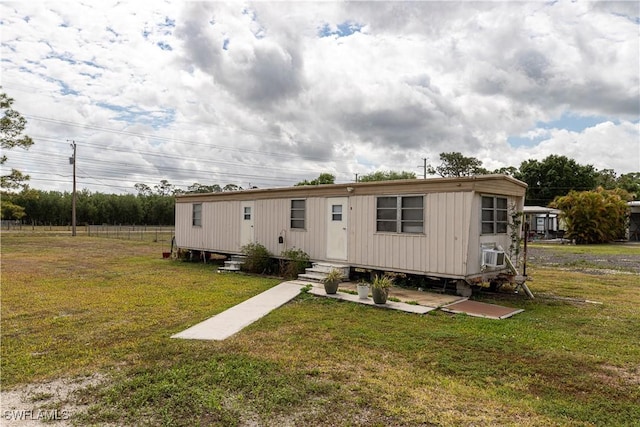 17841 Palm Creek Dr, North Fort Myers, FL 33917 - rear view of house featuring a yard and entry steps
