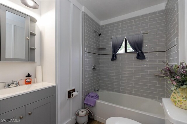 17841 Palm Creek Dr, North Fort Myers, FL 33917 - full bath featuring toilet, vanity, and washtub / shower combination