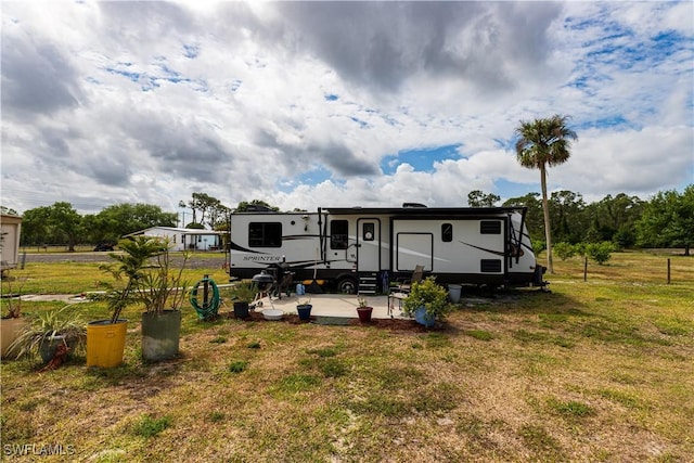 17841 Palm Creek Dr, North Fort Myers, FL 33917 - rear view of house with a yard and entry steps