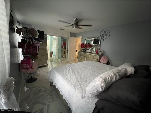 bedroom with a ceiling fan, marble finish floor, and visible vents