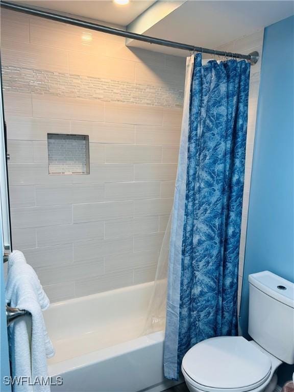full bathroom featuring shower / bath combo and toilet